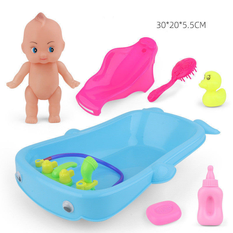 Baby Playing In Water Tub With Bath Toys